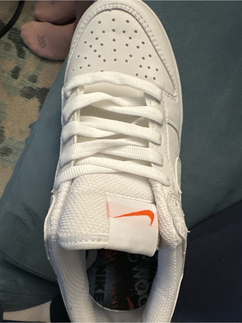 Nike White Low-Top Sneakers with Orange Swoosh Tongue Accent